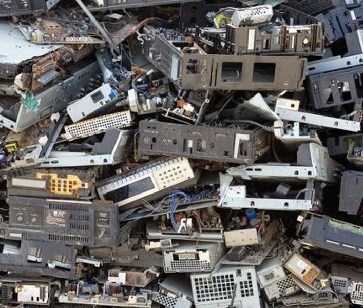 A pile of old electronics in the middle of a pile.